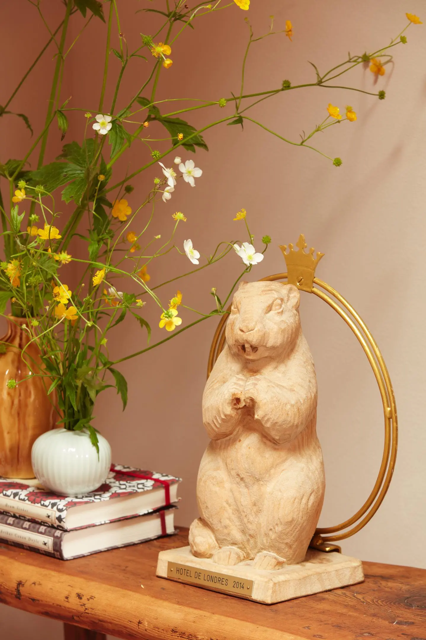 Murmeli wearing a crown, mascot of Hotel de Londres and symbol of its hospitality and motto “At Home with Friends